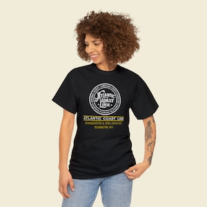 Joyful woman adorns herself with the Atlantic Coast Line Railroad ACL train shirt, a trendy train enthusiast gift