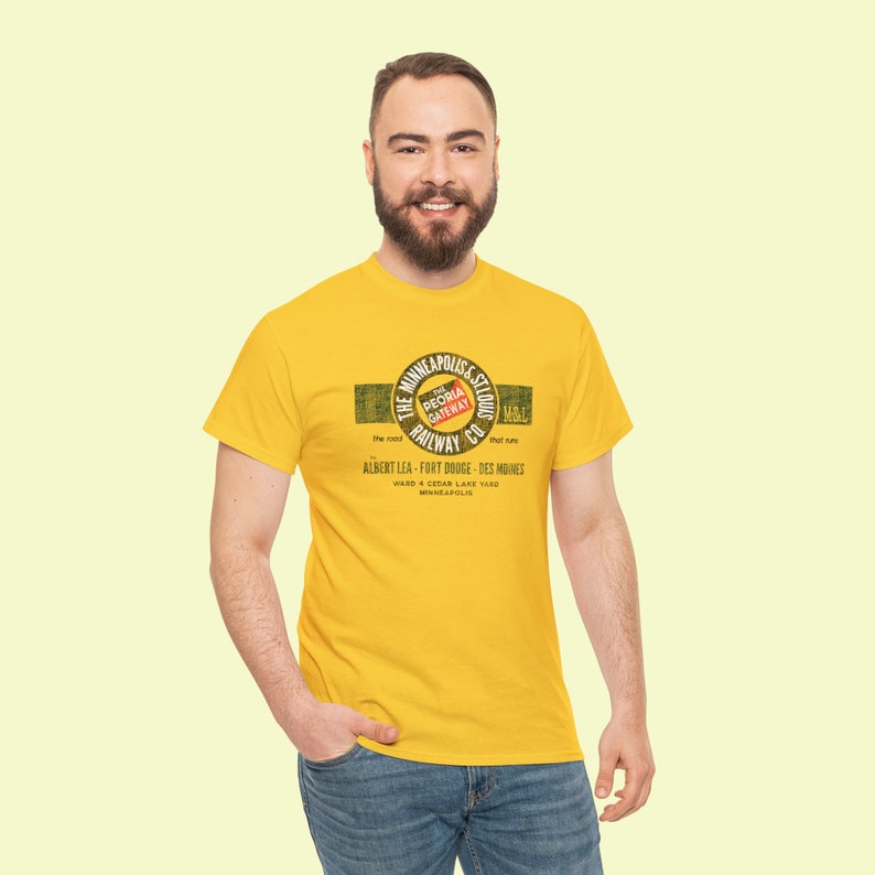 Man in his 20's wearing train t-shirt with Gold Minneapolis & St. Louis Railway logo