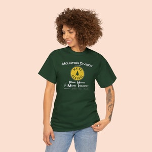 Young woman in her 20's posing, wearing Yellow or Green Maine Central Railroad t-shirt