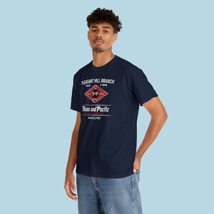 Handsome young man in Blue Texas and Pacific Railway train t-shirt. Perfect train lover gift