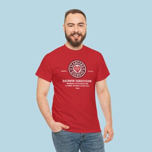 Stylish man in his 20's wearing Red Seaboard Air Line Railroad t-shirt, looking at you