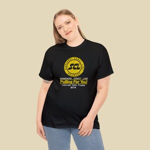 Stylish young woman in her 20's wearing Black Seaboard Coast Line Railroad shirt