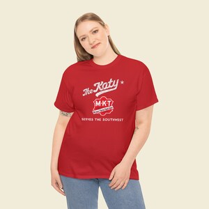 Stylish young woman in her 20's wearing Red/Gray Missouri-Kansas-Texas Railroad train tshirt, posing