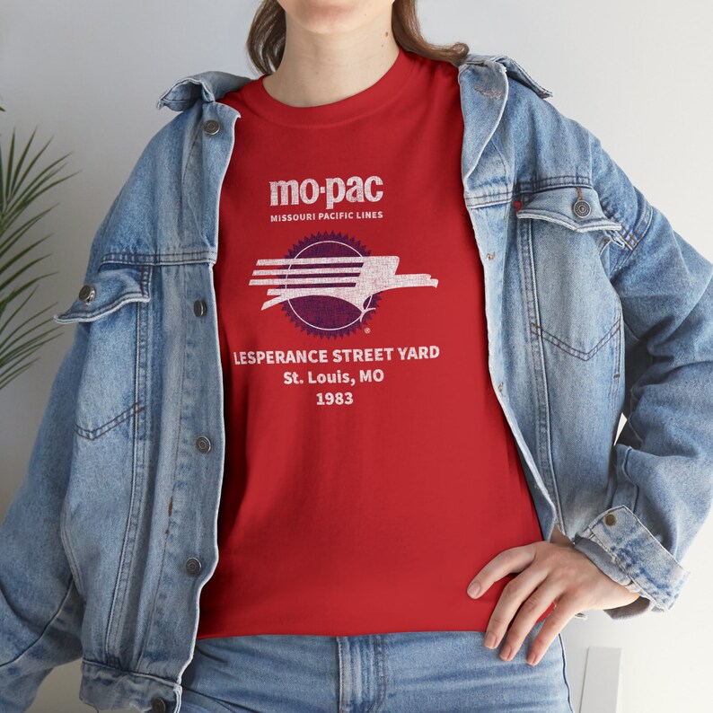 Lifestyle image: Woman wearing red MoPac railroad t-shirt, denim jacket over, facing left