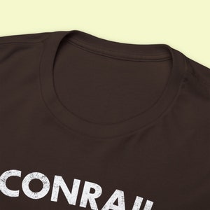 Closeup of front t-shirt collar neck ring on Conrail Brown CoilSHIELD CR shirt, a stylish train tshirt