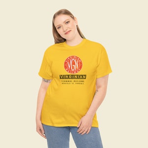 Young woman in her 20's confidently posing in the Gold Virginian Railway t-shirt