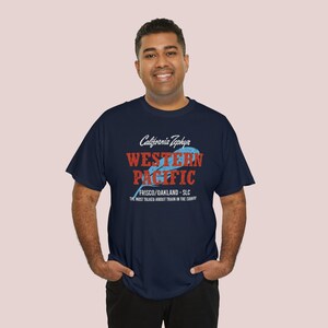 Happy man in his early 30's wearing Navy Western Pacific Railroad t-shirt, looking at you