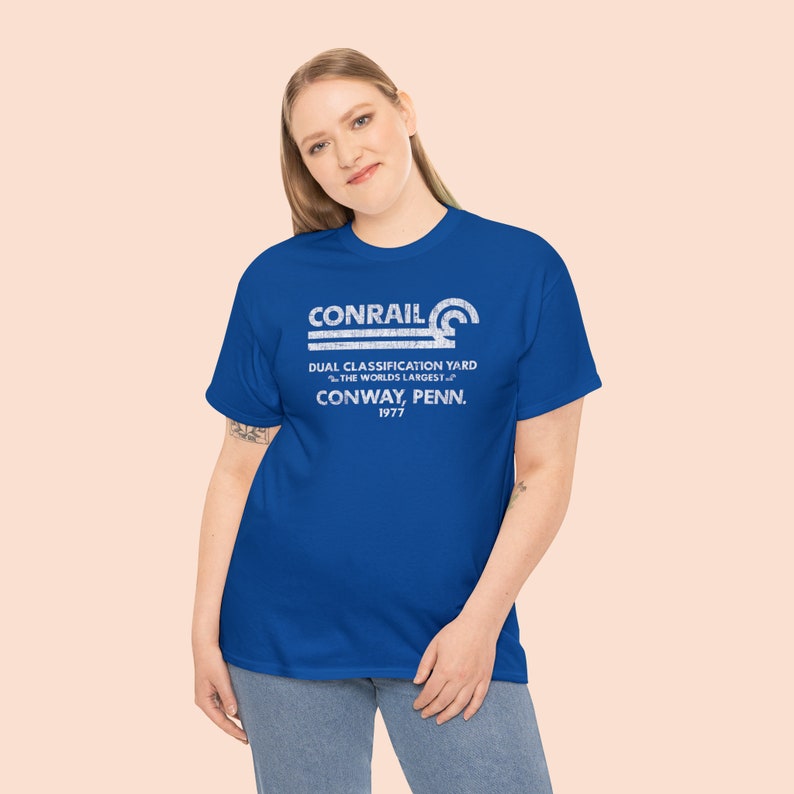 Posing young woman in her 20's wearing Conrail Royal Blue CR shirt, a trendy railroad tshirt