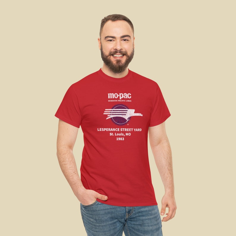 Handsome man in his 20's wearing red MoPac railroad t-shirt, looking at you