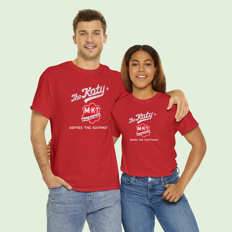 Young couple looking at us, both wearing Red/Gray Missouri-Kansas-Texas Railroad train tshirts