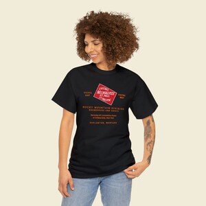 Happy young woman wearing Black Milwaukee Road t-shirt, a stylish train enthusiast gift