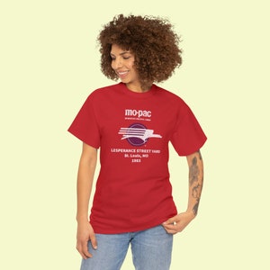 Happy young woman wearing red MoPac railroad t-shirt, looking left