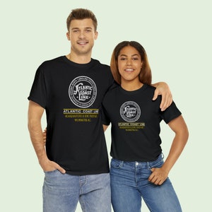 Smiling couple proudly wears the Atlantic Coast Line Railroad ACL shirts, perfect train gifts for men and women