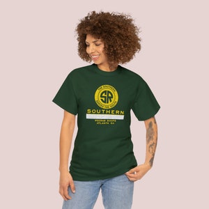 Posing woman in her 20s wearing a green Southern Railway t-shirt, a unique train gift