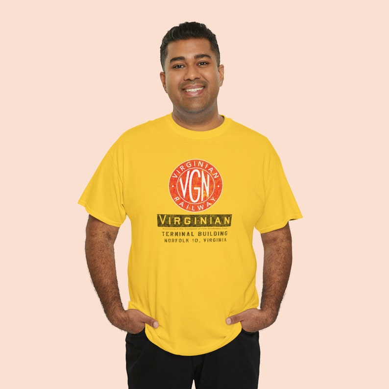 Joyful man in his early 30's happily wearing the Gold Virginian Railway t-shirt