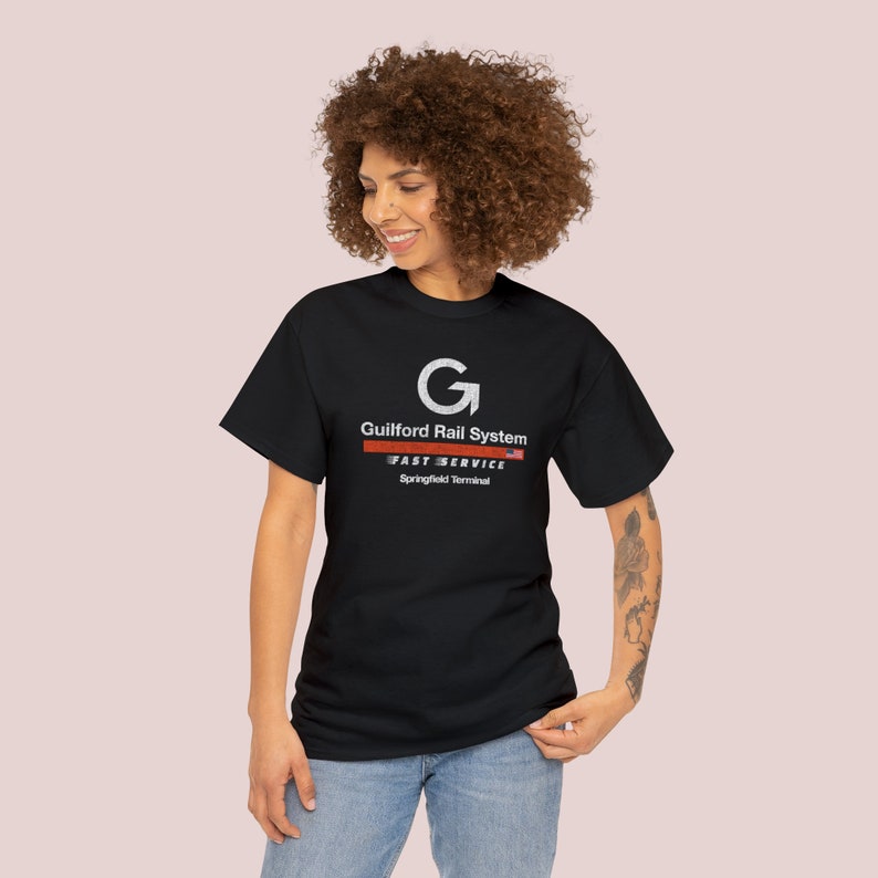 Happy young woman wearing Black Springfield Terminal Railway T-Shirt, looking left