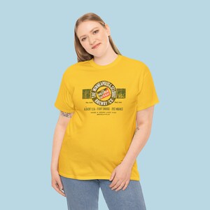 Smiling woman in her 20's posing in train t-shirt with Gold Minneapolis & St. Louis Railway logo