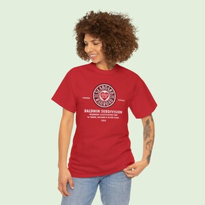 Happy young woman looking left, wearing Red Seaboard Air Line Railroad t-shirt