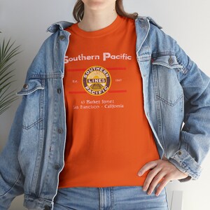 Lifestyle: Woman with denim jacket, Orange/Blue Southern Pacific Railway train t-shirt