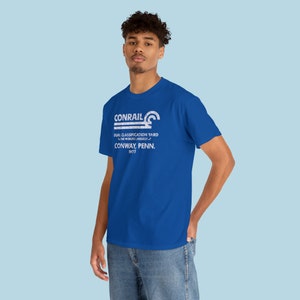 Cool young man wearing Conrail Royal Blue CR shirt, a stylish train lover gift