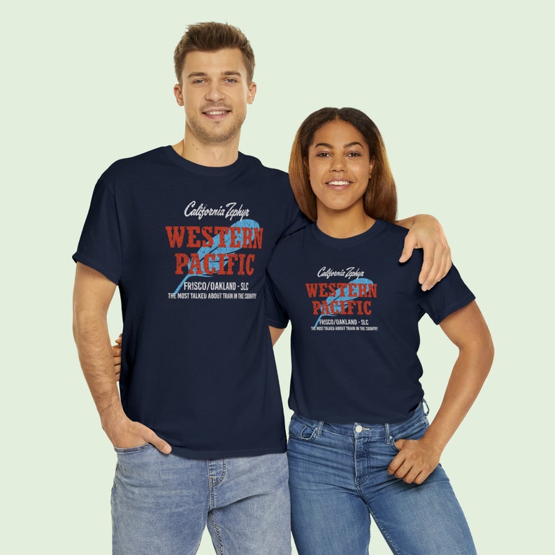 Young happy couple looking at us, both wearing Navy Western Pacific Railroad t-shirts