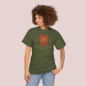 A happy young woman wearing the Olive Pennsylvania Railroad train lover gift