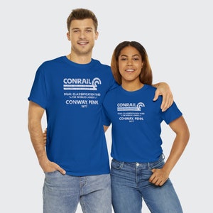 Happy young couple wearing Conrail Royal Blue CR shirts, perfect matching train enthusiast apparel