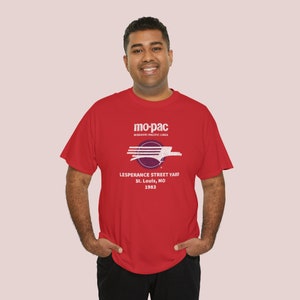 happy man in his early 30's wearing red MoPac railroad t-shirt, looking at you