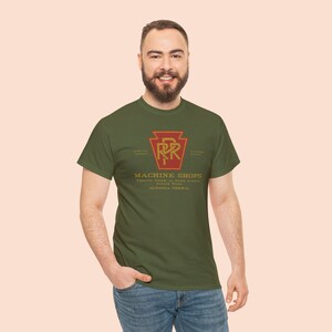 A man in his 20's wearing the Olive Pennsylvania Railroad train enthusiast gift