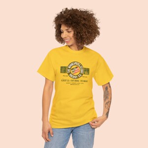 Happy young woman wearing train t-shirt with Gold Minneapolis & St. Louis Railway logo