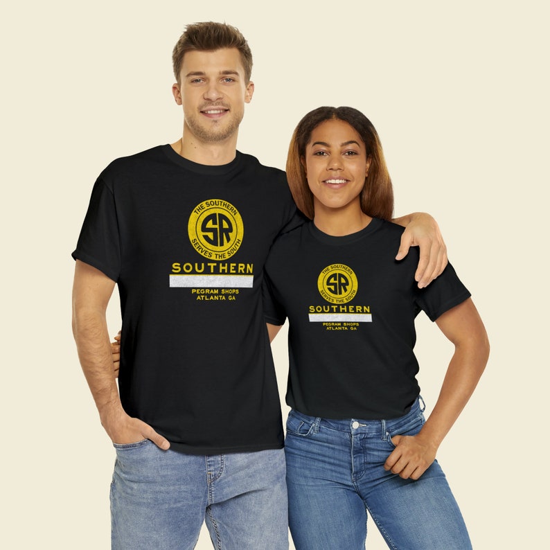 Happy couple wearing black Southern Railway shirts, perfect for train enthusiasts