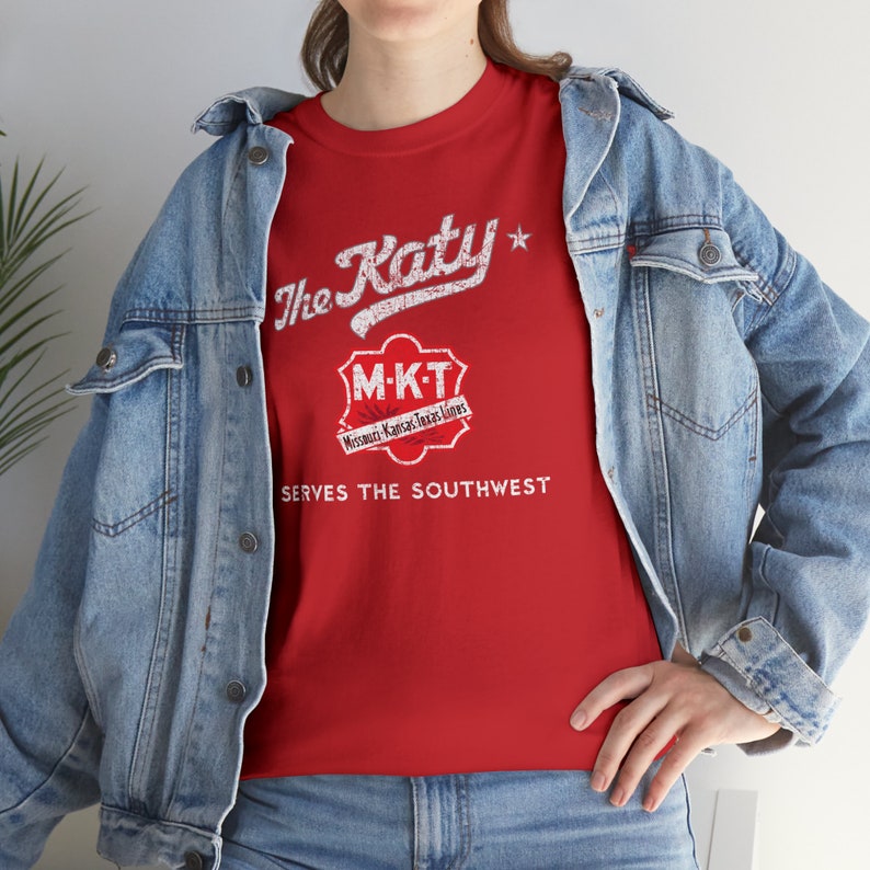 Woman wearing Red/Gray Missouri-Kansas-Texas Railroad train tshirt with denim jacket, facing left