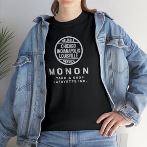 Woman in denim jacket wearing Black Monon Railroad t-shirt