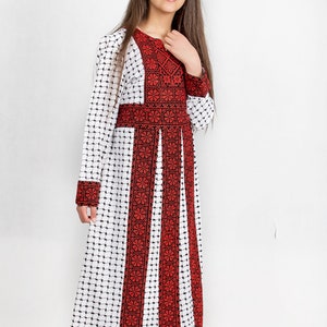 embroidery girl dress heritage Palestinian Jordanian tatreez school independence day