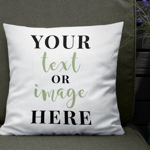 May include: White throw pillow with the text "YOUR text OR image HERE" in black and green lettering.