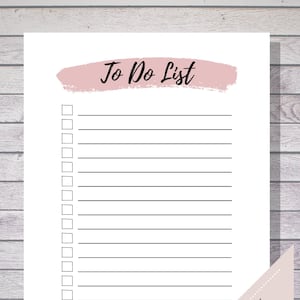 May include: A printable to-do list with a pink brushstroke background and the text "To Do List". The list has 18 blank lines with checkboxes.