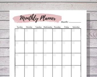May include: A printable monthly planner with a pink watercolor design at the top. The planner has a grid for each day of the week, with spaces for notes at the bottom. The text "Monthly Planner" is at the top of the page, and the text "Instant Download" is in the bottom right corner.