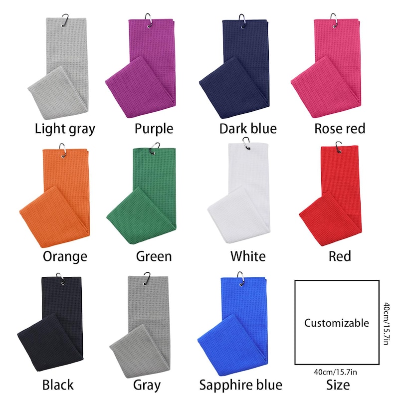 May include: A collection of golf towels in various colors, including light gray, purple, dark blue, rose red, orange, green, white, red, black, gray, and sapphire blue. Each towel is folded and has a metal hook. The size is 15.7 inches by 15.7 inches.
