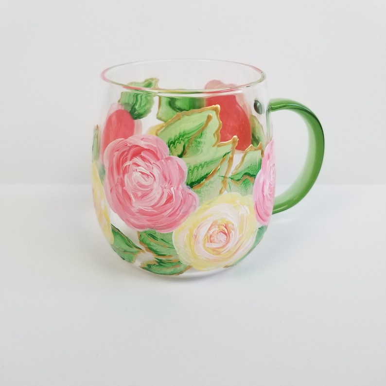 Rose mugs are perfect gifts for June birthdays, ideal for coffee or tea lovers. Painted in pastel colors with pearl touches, these 13oz clear mugs are made of durable, lead-free borosilicate glass, which is easy to clean and strong yet lightweight.