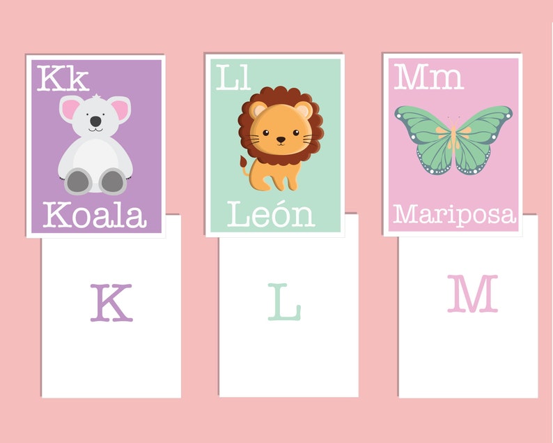 May include: Three colorful flashcards with letters K, L, and M. Each card features a different animal: a koala, a lion, and a butterfly. The words "Koala", "Le&oacute;n", and "Mariposa" are written below the animals.