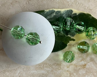 Swarovski Crystal Peridot 8mm round beads:  Set of ten