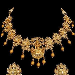 Indian Bridal Biju Temple Set with stunning pearl stone-setting on a gold plated necklace & earrings.