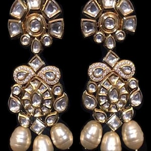 Laleh Kundan Earrings - Earrings based in silver and copper alloy and embellished with faux glass polki.