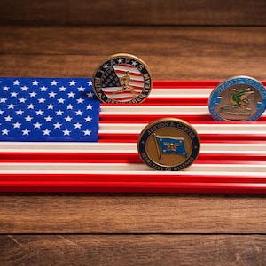 May include: A set of three ceramic mugs with a speckled, matte finish. The mugs are in shades of cream, light gray, and dark gray. Each mug has a simple, minimalist design, perfect for coffee or tea.