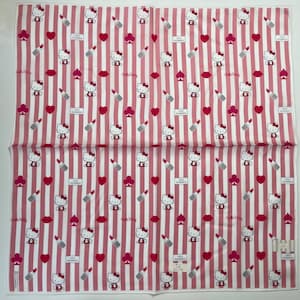 May include: A white cotton handkerchief with a pink and white striped pattern. The pattern features a repeating design of Hello Kitty, lips, hearts, spades, and lipstick. The text "Love Guinness" appears in the pattern.