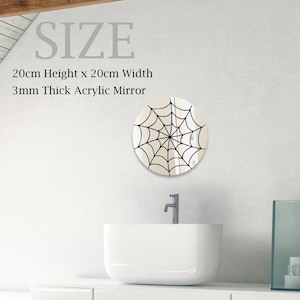 May include: A round, white acrylic mirror with a black spiderweb design. The mirror is 20 inches in diameter and 3/8 inch thick.  SIZE: 20cm Height x 20cm Width 3mm Thick Acrylic Mirror