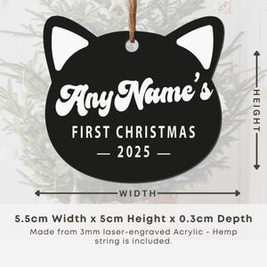 May include: Black cat-shaped Christmas ornament with white accents and the text "Any Name's First Christmas - 2025 -." The ornament is 5.5cm wide, 5cm high, and 0.3cm deep. Includes a hemp string for hanging.
