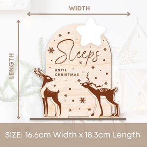 May include: Wooden Christmas countdown sign featuring two deer silhouettes and the text "Sleeps Until Christmas". The sign measures 16.6 cm wide and 18.3 cm long.