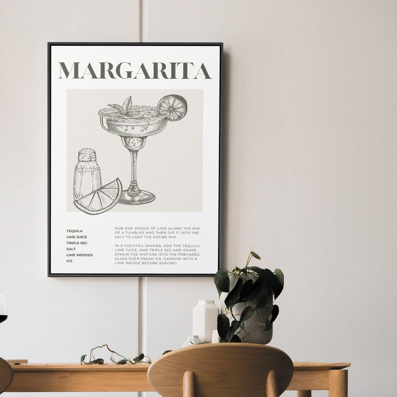 May include: A black and white printable poster with a drawing of a margarita cocktail and the ingredients and instructions for making the drink. The text reads "MARGARITA" and includes the ingredients: Tequila, Lime Juice, Triple Sec, Salt, Lime Wedges, Ice. The instructions read: "Rub one wedge of lime along the rim of a tumbler and then dip it into the salt to coat the entire rim. In a cocktail shaker, add the tequila, lime juice, and triple sec and shake. Strain the mixture into the prepared glass over fresh ice. Garnish with a lime wedge before serving."