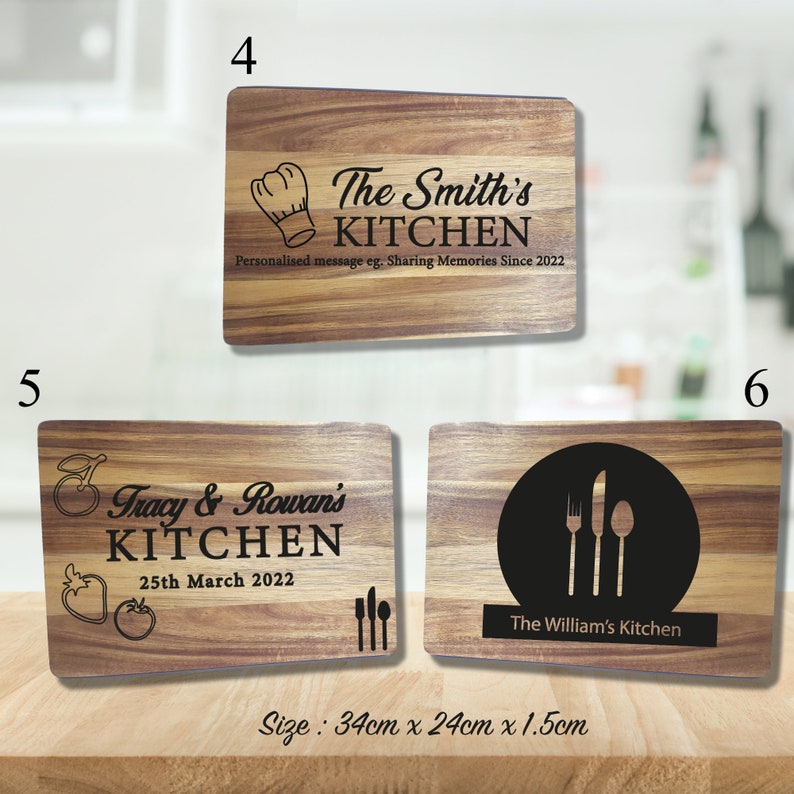 May include: Three wooden cutting boards with personalized text. The first board says "The Smith's Kitchen" with a chef's hat graphic. The second board says "Tracy & Rowan's Kitchen" with a red apple graphic and the date "25th March 2022". The third board says "The William's Kitchen" with a fork, knife, and spoon graphic. The boards are 34 cm x 24 cm x 1.5 cm.